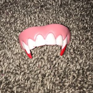Rubber vampire teeth/ fully sanitized and clean.